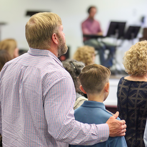 Father and son in church